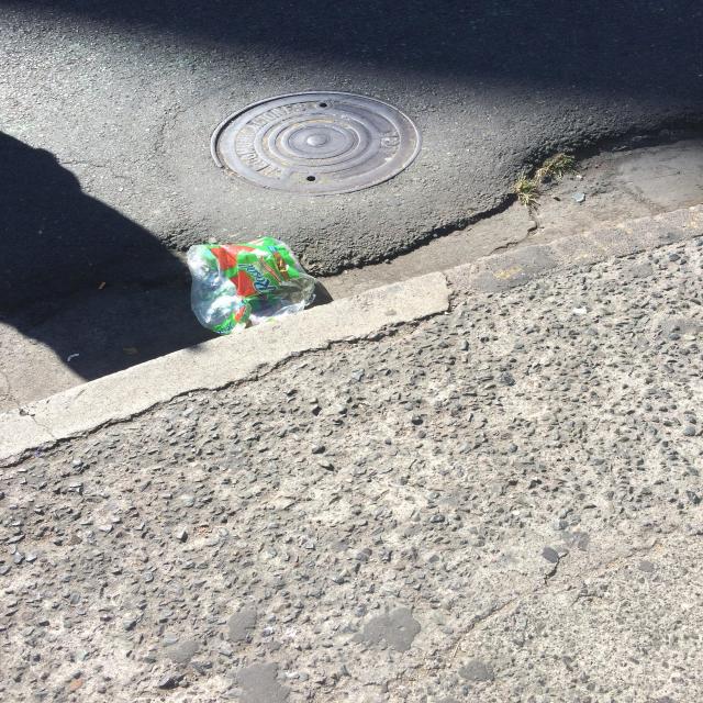 Discarded packaging by a kerb